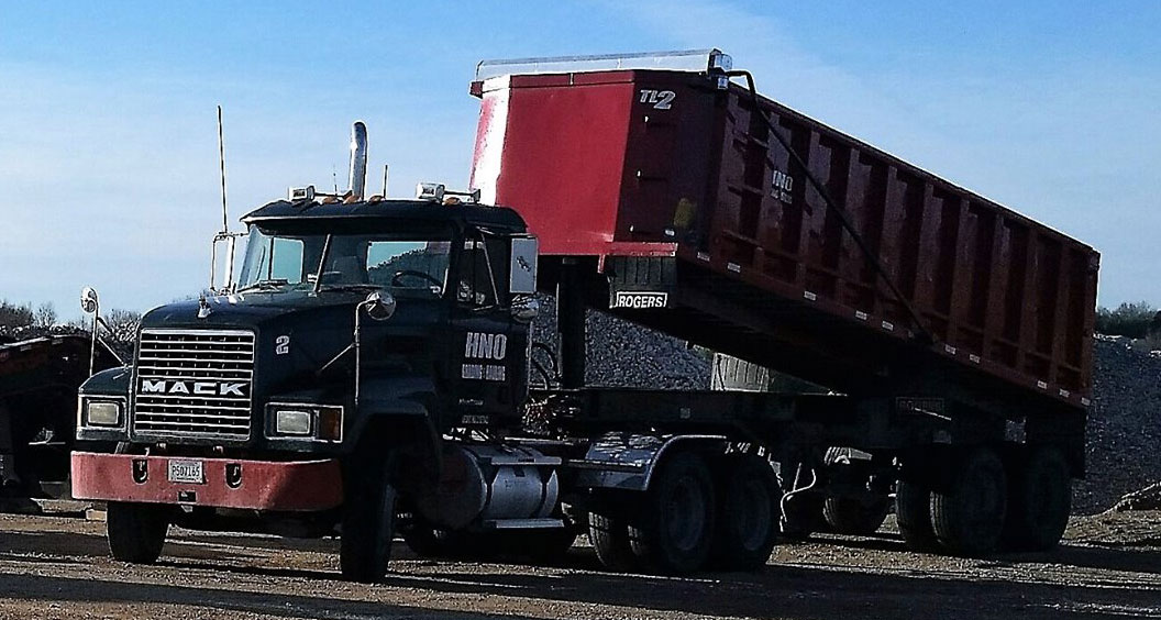 Dump Trailer Hauling Dumping