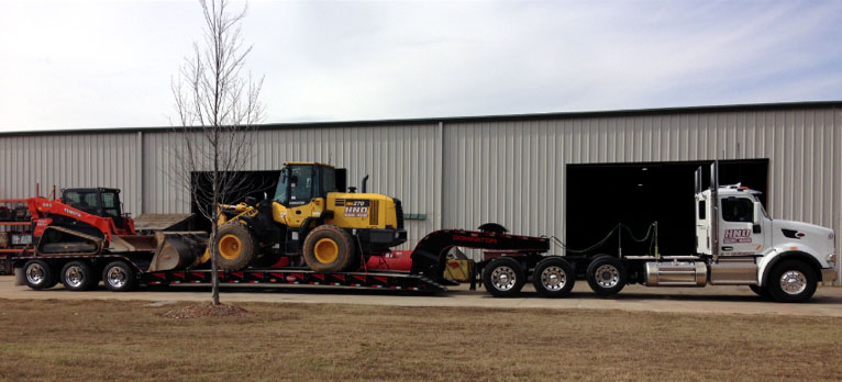 Lowboy Hauling Earth Mover